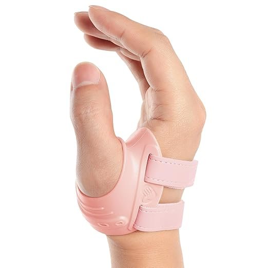 Hand wearing a pink ergonomic thumb splint providing gentle thumb arthritis support and CMC joint stabilization.